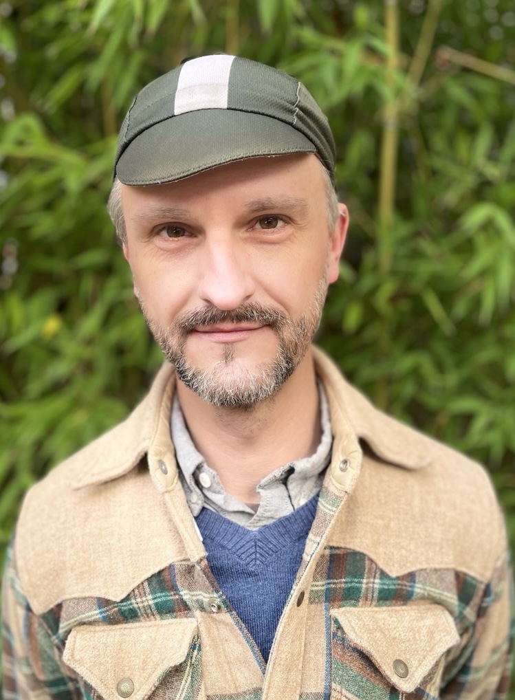 A close-up portrait of Bike East Bay staff member Robert Prinz