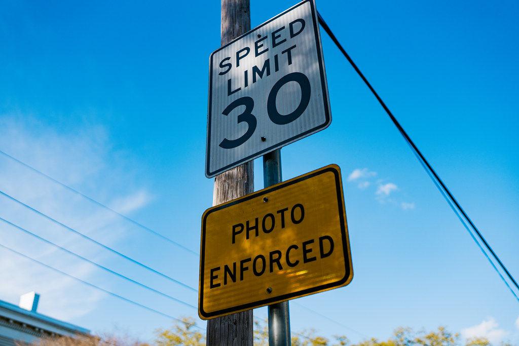 photo of a speed limit sign - text: "Speed limit 30 - photo enforced"
