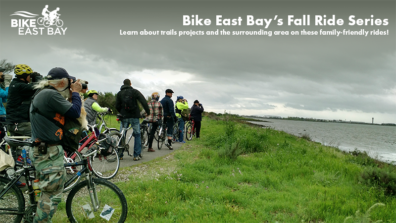 "Bike East Bay's Fall Ride Series Learn about trails projects and the surrounding area on these family-friendly rides!" Photo of bike riders standing along a grassy shoreline and looking out toward the Bay