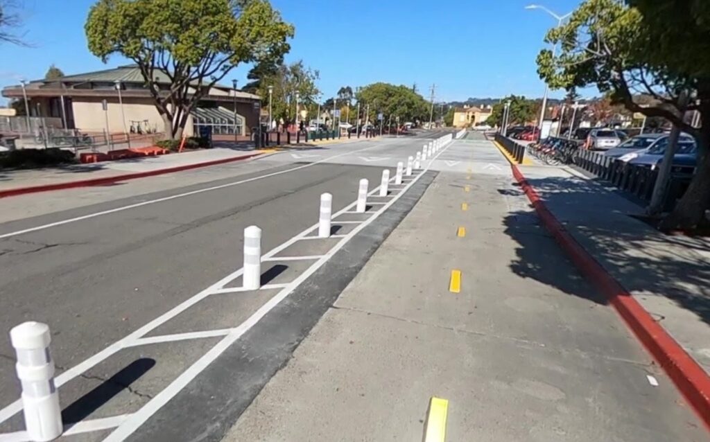 Photo of a flex post-protected 2-way cycletrack at North Berkeley BART