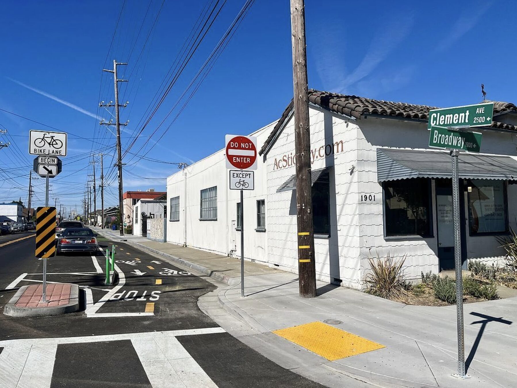 photo of a cubside, 2-way protected cycletrack on Clement Ave in Alameda, with cars parked alongside