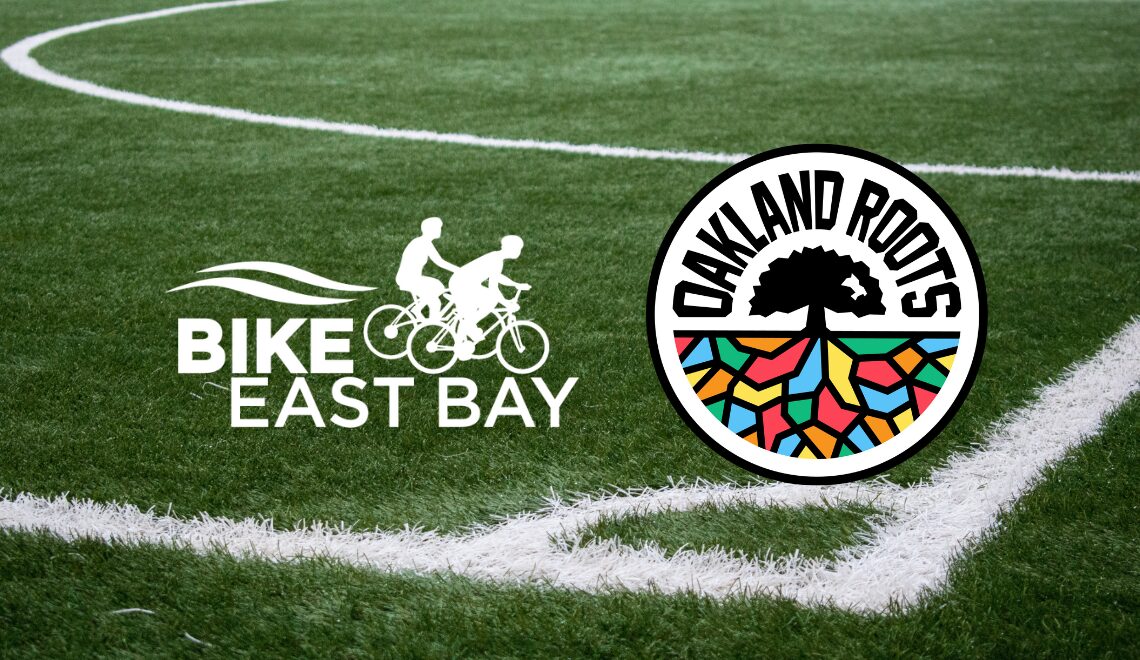 Bike East Bay and Oakland Roots logo overlaid on a picture of a soccer field