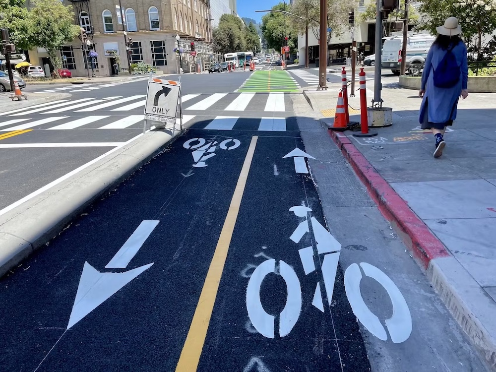 photo of a concrete curb separated 2-way cycletrack on Bancroft Ave in Berkeley