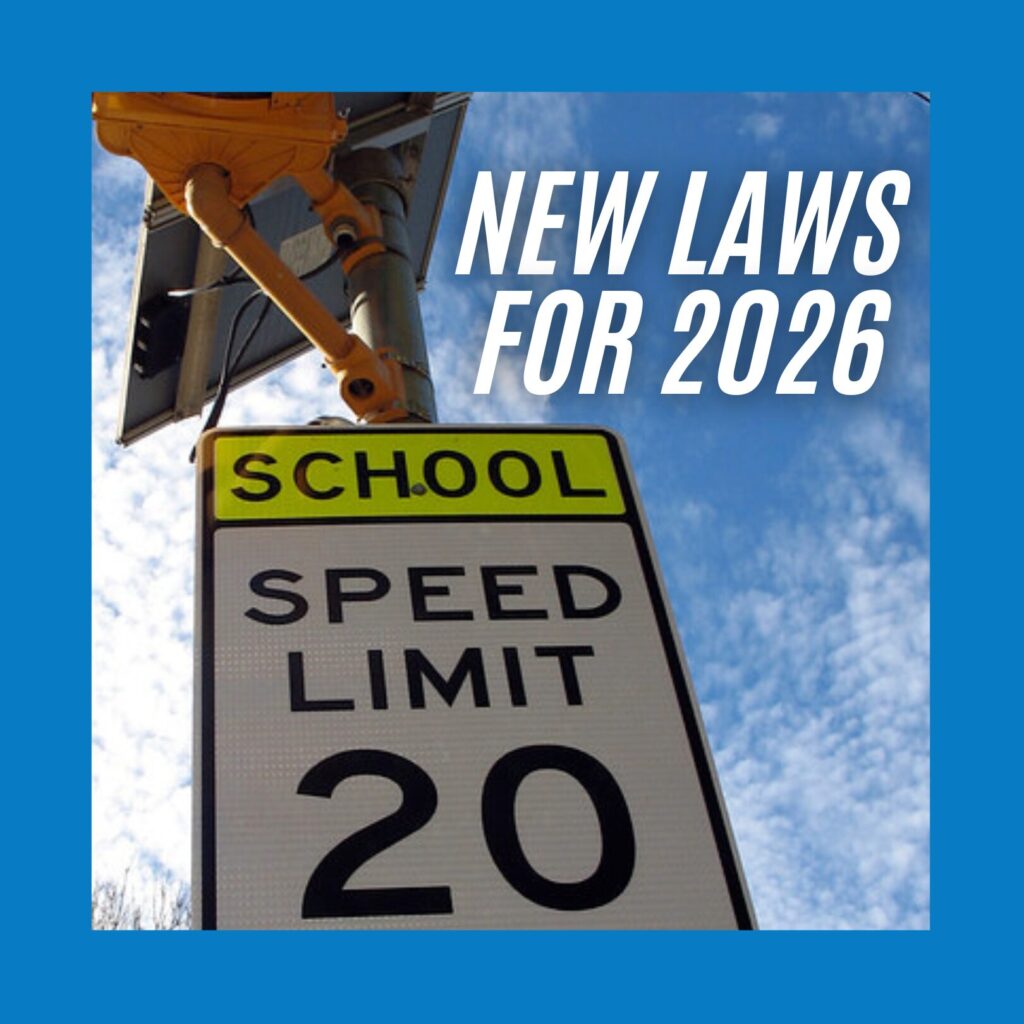 "New Laws for 2026" close up photo of a street sign reading "school speed limit 20"