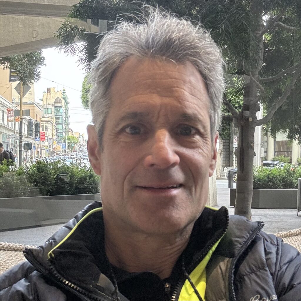 Board member Geoff smiles in a selfie