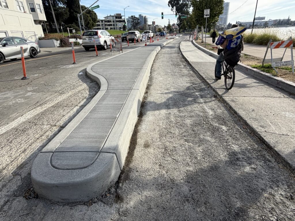 photo of curb-protected bikeway construction on Lakeshore Ave in Oakland